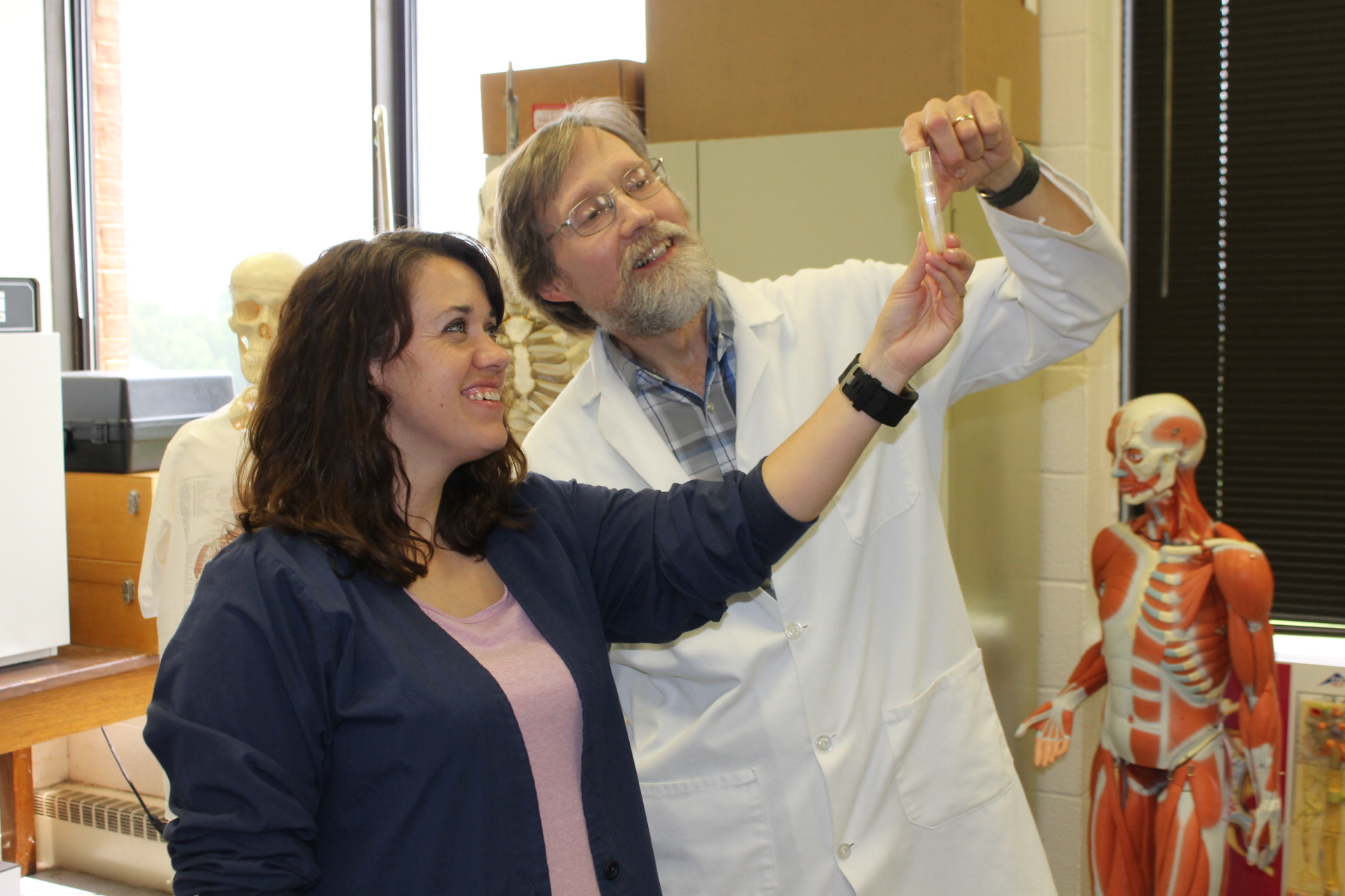 SIC’s 2018 Outstanding Faculty Member of the year John Shultz (right) works with student Stephanie Dowdy during microbiology.