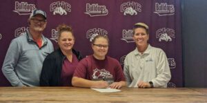 Kassi Milligan signs with SIC surrounded by family and SIC coach Maggie Calcaterra