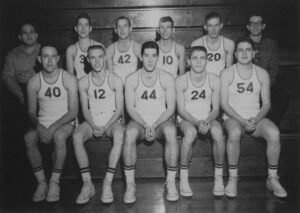 The 1962 SIC Falcons Basketball Team Sits In Bleachers