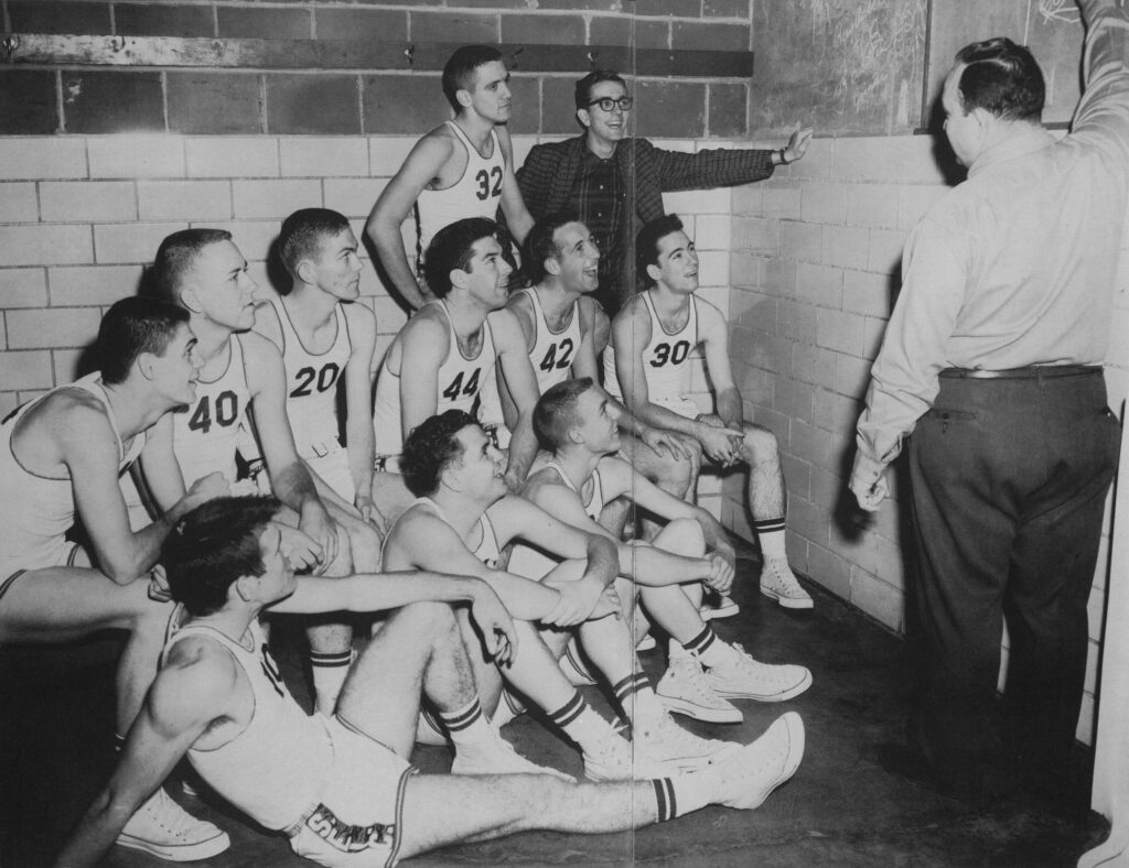 The first SIC basketball team prepares for the game in the locker room at Davenport Gym in Harrisburg.