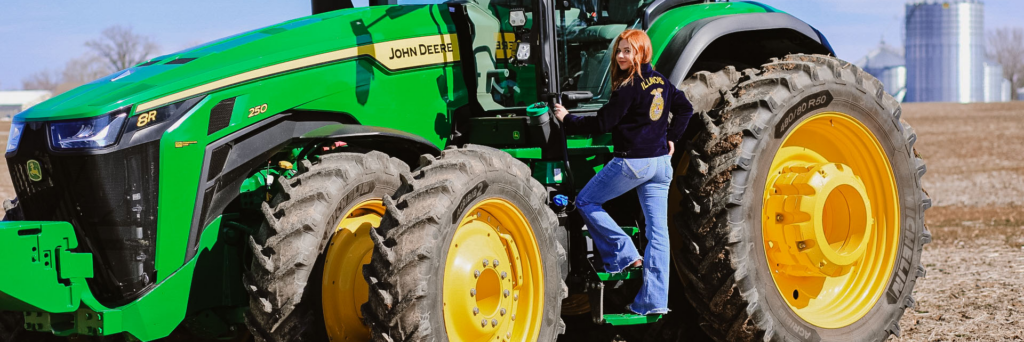 FFA Student Kailyn and Tractor
