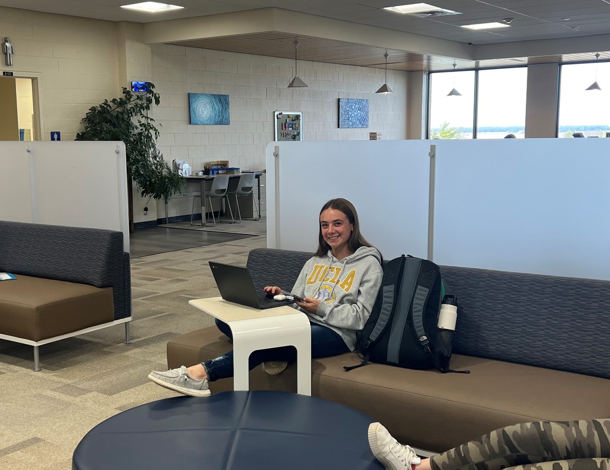 Student On Couch In Learning Commons