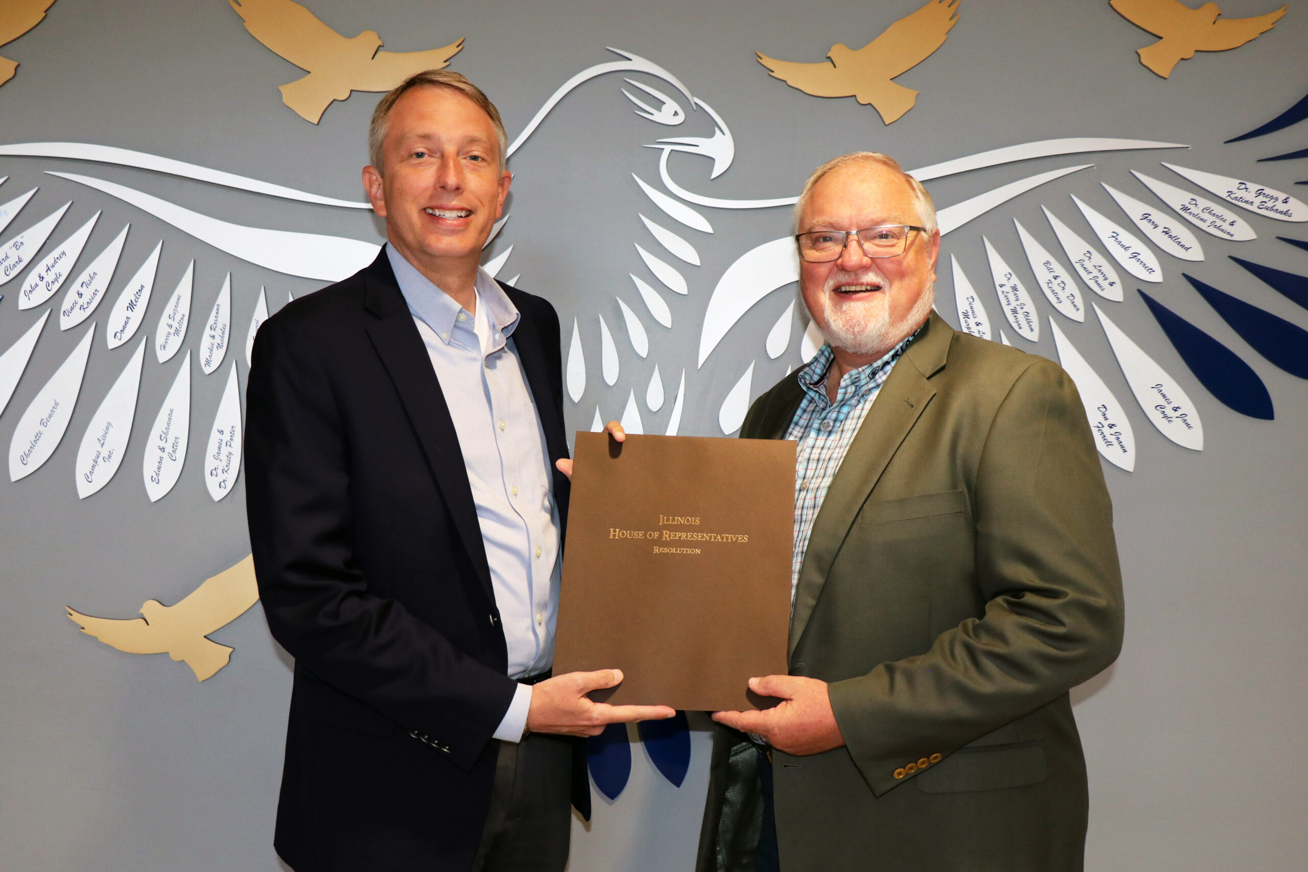 Illinois State Representative Patrick Windhorst (left) presents Southeastern Illinois College President Dr. Jonah Rice with Illinois House Resolution 0815.