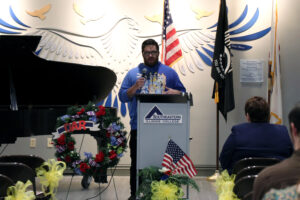 Sergeant Tyler Morgan delivers the keynote address at Southeastern Illinois College’s Veterans Recognition Ceremony in the George T. Dennis Visual & Performing Arts Center Lobby.
