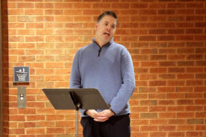 Dr. Tyler Billman leads the audience in singing the National Anthem during SIC’s Veterans Recognition Ceremony.